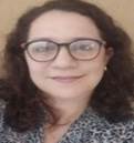 Persona con lentes sonriendo

Descripción generada automáticamente